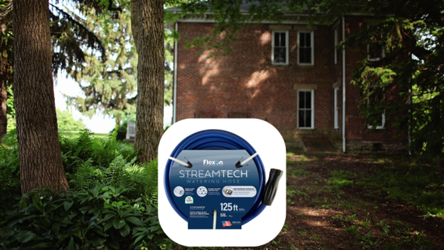 Technician coiling Streamtech Heavy Duty Hose after washing equipment